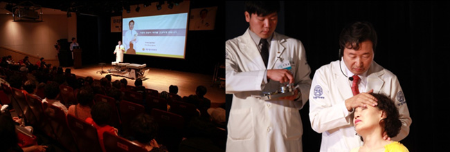 강연 중 목에 이상이 있는 환자를 무대위로 불러내 침 치료와 추나요법 등을 시연해 보이며 환자를 치료하는 신준식 박사